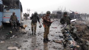 Supporters of Pakistan's former Prime Minister Imran Khan throw stones towards police during a protest against Khan's arrest, in Peshawar, Pakistan.