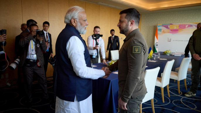 Ukraine's President Volodymyr Zelenskiy and Indian Prime Minister Narendra Modi shake hands during the G7 leaders' summit in Hiroshima, Japan 20 May, 2023. Ukrainian Presidential Press Service/Handout via REUTERS
