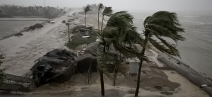 Rescue workers remove the fallen tress after a storm in Teknaf, near Cox's Bazar, Bangladesh, Sunday, May 14, 2023.