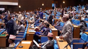 Lawmakers attend a meeting of House of Representatives on Sunday.