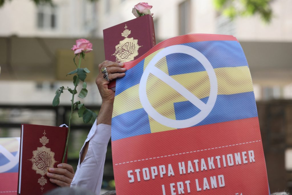 An Iranian protester holds the Koran in his hand, during a protest against a man who burned a copy outside a mosque in the Swedish capital Stockholm, in front of the Swedish Embassy in Tehran, Iran July 3, 2023. Majid Asgaripour/WANA (West Asia News Agency) via REUTERS/File Photo